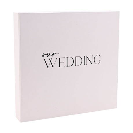 Square white "Our Wedding" photo album with matching box, featuring "our" in script and "WEDDING" in capitals on the front, shown against a plain background.