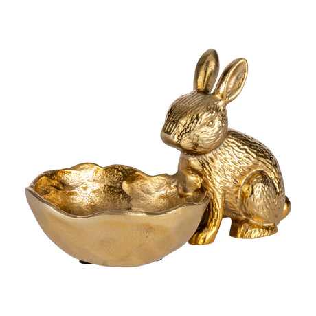 Ambalava Rabbit Ornament in gold aluminium, a seated rabbit figure with textured fur beside an attached eggshell-shaped bowl with a wavy rim, on a plain white background.