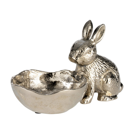 Ambalava Rabbit Ornament in nickel-finished aluminium, a seated rabbit with textured fur and upright ears beside a wavy-edged eggshell-shaped bowl, on a plain white background.