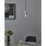 Pendant light with a white ceiling cap and black cable fitted with an Amber Dimmable LED Bulb E27 4W, teardrop amber glass filament bulb, shown lit above a dining table.