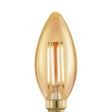 Amber glass LED candle bulb, C35 shape with E14 brass-coloured screw cap, visible upright filaments, on a plain white background.