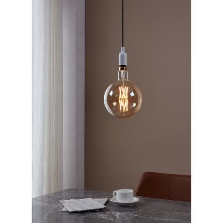 Amber Dimmable LED Globe Bulb E27 G200 pendant lit above a marble dining table, showing the criss-cross filament lattice and gold-toned cap.