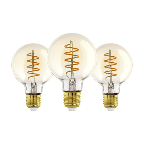 Set of three amber LED globe bulbs, G80 shape, with spiral filaments and brass-coloured E27 screw caps, shown on a plain white background.