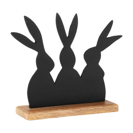 Amoatsy Rabbit Ornaments sculpture with three joined matt black aluminium rabbit silhouettes on a natural mango wood base, shown against a plain white background.