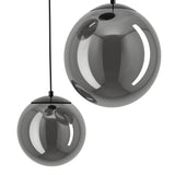 Anorias Colour Changing Smoked Glass 3 Light Pendant, close-up of two smoked glass globes with mirror-like sheen and black nickel fittings on a plain white background.