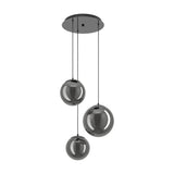 Anorias 3 Light Pendant with round black nickel ceiling canopy and three smoked glass globe shades in varying sizes, shown on a plain white background.