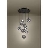 Anorias 9 Light Pendant with smoked glass globes of varying sizes cascading at different heights from a round black nickel ceiling canopy.