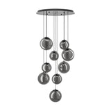 Anorias 9 Light Pendant with smoked glass globes of varying sizes cascading at different heights from a round black nickel ceiling canopy, shown on a plain white background.