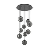 Anorias 9 Light Pendant with smoked glass globes in varying sizes cascading from a round black nickel ceiling canopy on slim cables, shown on a white background.