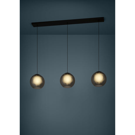 Arangona Glass Linear Pendant Light in black, three smoked grey globe shades on black cords suspended from a long black steel ceiling bar, shown illuminated against a dark blue background.