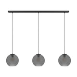 Arangona linear pendant light with three smoked grey glass globe shades hanging from black cords on a black steel ceiling bar, shown on a plain white background.