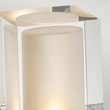Close-up of the Arendal 1 Light Large Bollard in black, showcasing its modern geometric design. Ideal for coastal environments, this bollard features frosted glass and reflective metallic surfaces, providing a soft, ambient glow along with a durable lighting solution.