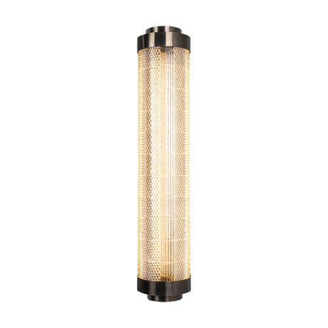 Ashford Acrylic LED Wall Light in 79.6cm, a slim cylindrical tube with diamond-textured acrylic and vertical ribs between stepped brass end caps, shown lit against a plain white background.