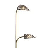 The Ashton 2 Light Crystal Floor Lamp in antique brass features two curved arms with crystal ring shades adorned with glass crystals, providing warm ambient lighting.