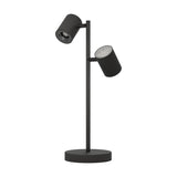 Auro LED Table Lamp in black steel, featuring two cylindrical spot heads on a slim upright stem above a round disc base, shown on a plain white background.