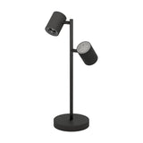 Auro LED Table Lamp in black steel, with two adjustable cylindrical spot heads on a slim upright stem and round disc base, shown on a plain white background.