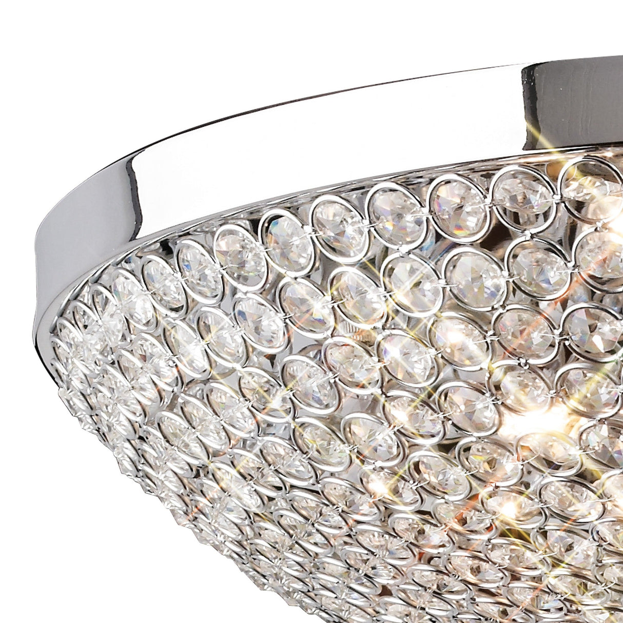 Close-up of Diyas Ava 6 light flush ceiling light with polished chrome frame and hemispherical dome of faceted clear crystals with lit G9 bulbs inside.