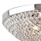 Close-up of Diyas Ava 6 light flush ceiling light with polished chrome frame and hemispherical dome of faceted clear crystals with lit G9 bulbs inside.
