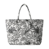 Bachuma Bag in Black, a fabric tote with two shoulder handles, featuring a black jungle toile print of palms, parrots, a leopard and tiger on an off-white ground.