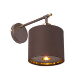 The Balance 1 Light Wall Light in Brown/Polished Brass offers a mid-century modern appeal with its wall-mounted design. It features a cylindrical shade that casts a warm, focused glow downward, complemented by a circular base and slim arm for a minimalist look. Optional polished brass accents add an elegant touch to the overall design.