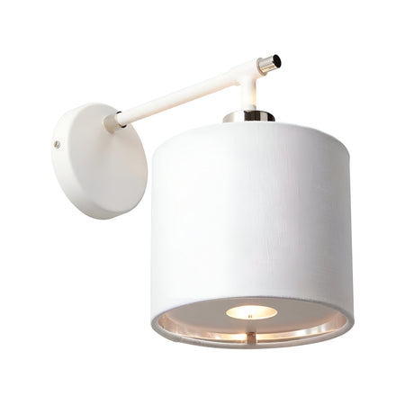 The Balance 1 Light Wall Light - White/Polished Nickel features a cylindrical white shade attached to a sleek polished nickel arm, extending from a circular base. Its design directs light downward, offering an energy-efficient option with a minimalist and contemporary appeal.