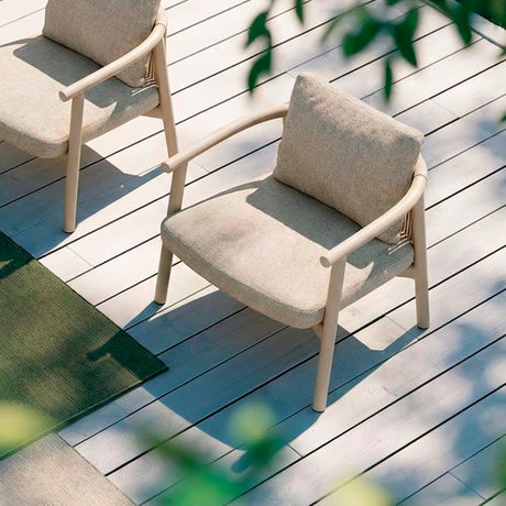 Balm Garden Lounge Chair Cushion Set in beige fabric, shown as seat and back cushions fitted to rope-armed aluminium chairs on an outdoor deck.