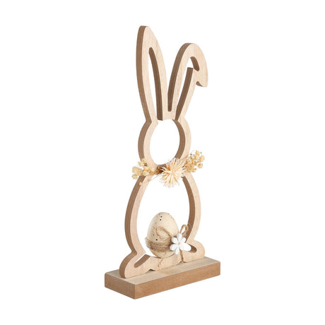 Balmaha Rabbit Ornament, a cut-out wooden rabbit figurine in beige and brown with a dried flower collar and speckled egg in a twine nest, set on a brown block base against a white background.