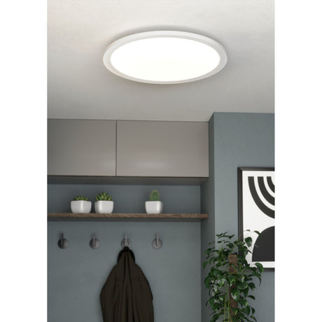 Balvena LED Flush Ceiling Light 45cm in White, round low-profile fixture with aluminium frame and plastic diffuser, shown mounted in a hallway with grey cabinets and wall hooks.