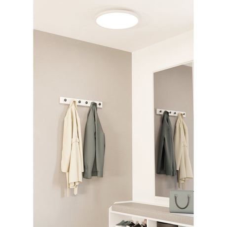 Balvena 45cm Smart LED Flush Ceiling Light in white, round and slim, shown on a hallway ceiling above a wall-mounted coat rack and mirror.