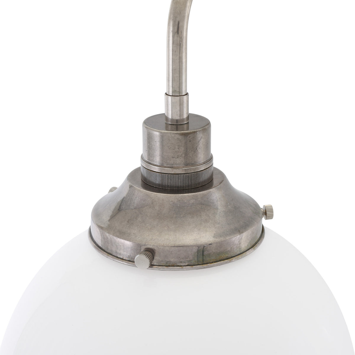 Close-up of the Bamako Glass Globe Wall Light showing the opal glass sphere beneath an antique silver finish holder and curved metal arm, on a plain white background.