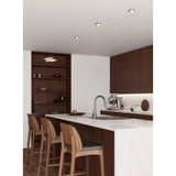 Barranco Downlight set of 3 recessed in a satin nickel finish, shown fitted into a kitchen ceiling above a wooden island and cabinetry.