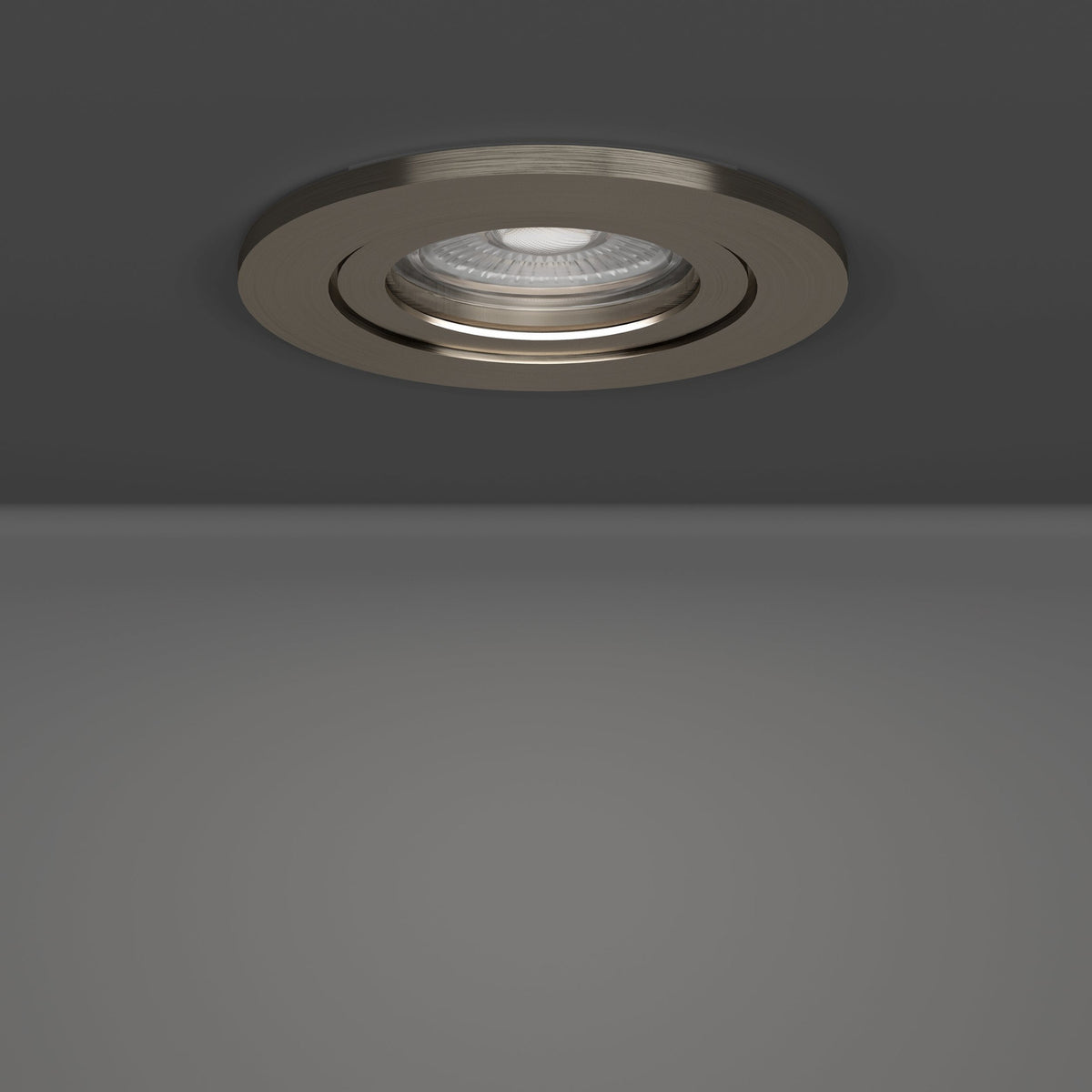 Round LED downlight from the Barranco set of 5, satin nickel finish with tiltable trim and integrated LED, recessed in a grey ceiling.