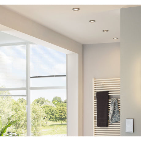 Baselle Fixed Downlight Set of 3 in satin nickel, round recessed fittings installed in a bathroom ceiling above a window and heated towel rail.