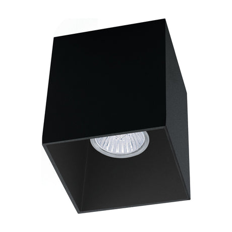 Basmorne square flush ceiling light in black aluminium, a cube-shaped fixture with a recessed GU10 bulb, shown on a plain white background.
