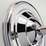 Close-up of the Austen-1 Wall Light - Polished Chrome, showcasing its sleek, modern design. The surface gleams as it reflects light, emphasizing its shiny, polished appearance.