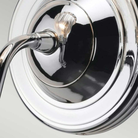 Close-up of the Carroll-2 Wall Light in polished chrome, featuring a curved arm and visible bulb socket. This IP44 rated fixture boasts a sleek, modern design against a neutral background, making it an ideal choice for contemporary lighting.