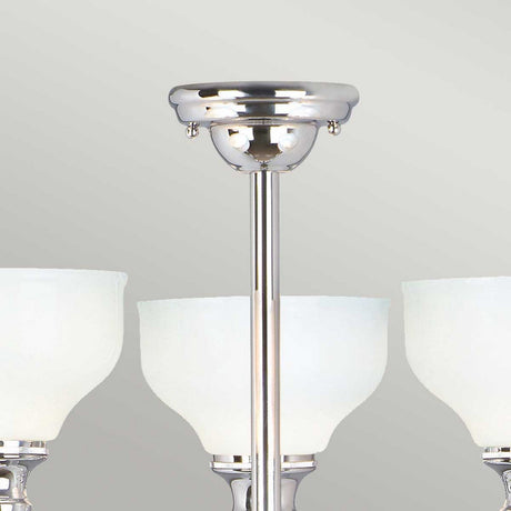 A close-up of the Cheadle 3 Light Semi Flush - Polished Chrome, featuring a sleek design with opal glass shades and three curved lamp fixtures. The polished chrome ceiling mount is clearly visible against a neutral gray background.