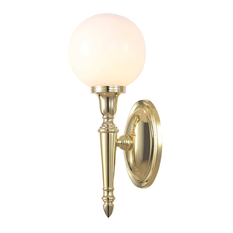 The Dryden-3 Wall Light in polished brass boasts an oval backplate that supports a single, elegant fixture. It features a slender, tapered arm that holds a frosted white globe-shaped bulb with an LED G9 lamp, offering a classic and sophisticated design to any space.