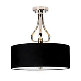 The Falmouth 3 Light Semi Flush - Polished Chrome/Black Shade boasts a contemporary design with elegant curves supporting its wide black drum shade, perfectly complemented by a polished chrome fixture. This modern ceiling light integrates sophisticated LED technology for an upscale look.
