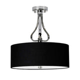 The Falmouth 3 Light Semi Flush - Polished Chrome/Black Shade features a contemporary design with a polished chrome finish complemented by an expansive black drum-shaped fabric shade. The elegant curved metal details create a seamless connection between the shade and ceiling mount, enriched by integrated LED technology for added sophistication.