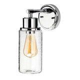 The Morvah 1 Light Outdoor Wall Light - Polished Chrome is a wall-mounted fixture that boasts a polished chrome finish with a transparent glass shade. It features a vintage-style bulb, providing a soft, warm glow, and its sleek and modern design effortlessly complements contemporary interiors.