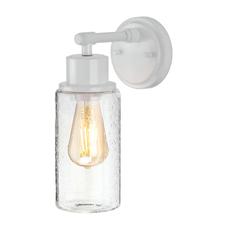 The Morvah 1 Light Outdoor Wall Light in white features a wall-mounted sconce with a clear, textured glass shade. It houses an LED Edison bulb that emits a warm glow, highlighting its minimalist and modern design. Ideal for outdoor spaces, it is IP44 rated, providing durability across various weather conditions.