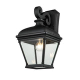 The Bayview 1 Light Outdoor Large Wall Lantern in Black features a Georgian-inspired design with a clear glass enclosure. It exudes traditional elegance with its scroll detail on the top mounting bracket and a visible light bulb inside, making it perfect for enhancing outdoor spaces.