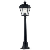 The Bayview 1 Light Medium Pillar Lantern - Black exudes Georgian-inspired elegance with its classic black lamp post and lantern-style fixture. Clear glass panels showcase the bulb within, while the post stands securely on a square base, adding timeless outdoor lighting charm to any garden or patio.