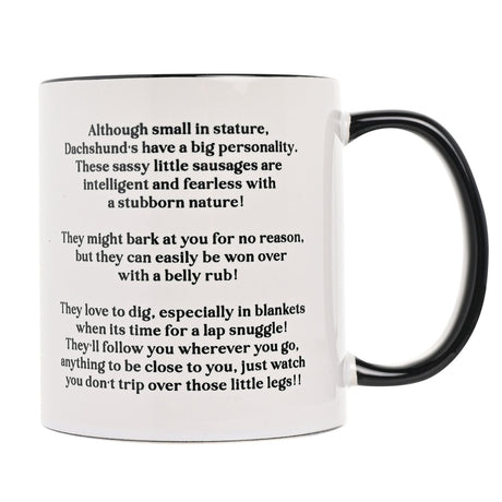White ceramic Dachshund mug, 11oz, with black handle and interior, showing printed text describing the breed's personality on a plain white background.