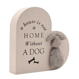 Heart-shaped grey MDF wall plaque reading a house is not a home without a dog, featuring two bone icons and a raised textured dog figure, shown on a white background.