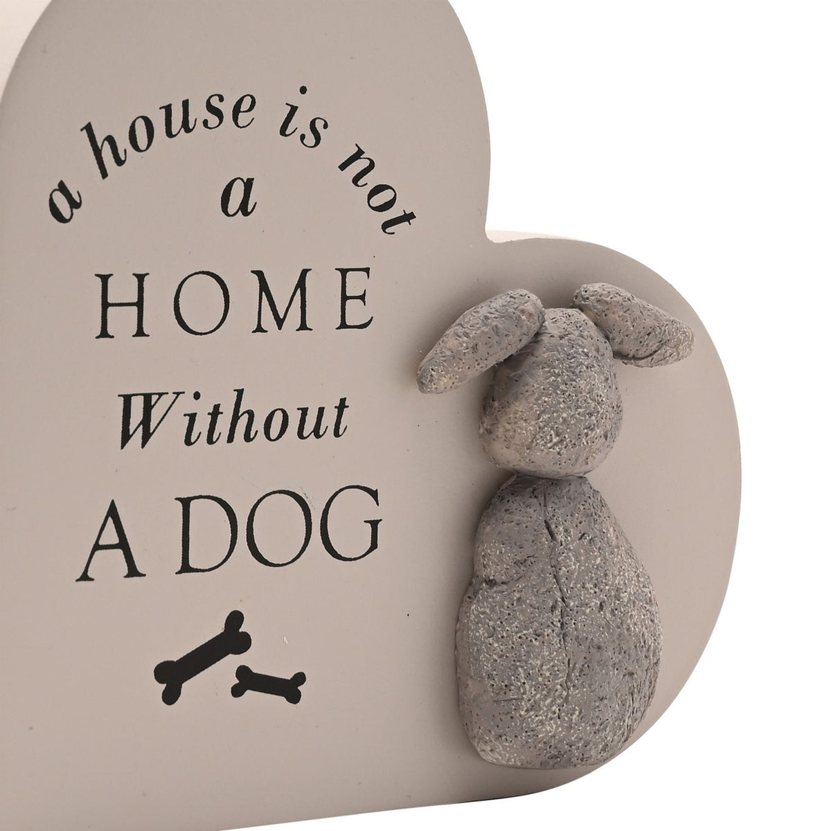 Heart-shaped MDF wall plaque in warm grey with black text reading "a house is not a home without a dog," two bone icons, and a raised textured grey dog figure with floppy ears.