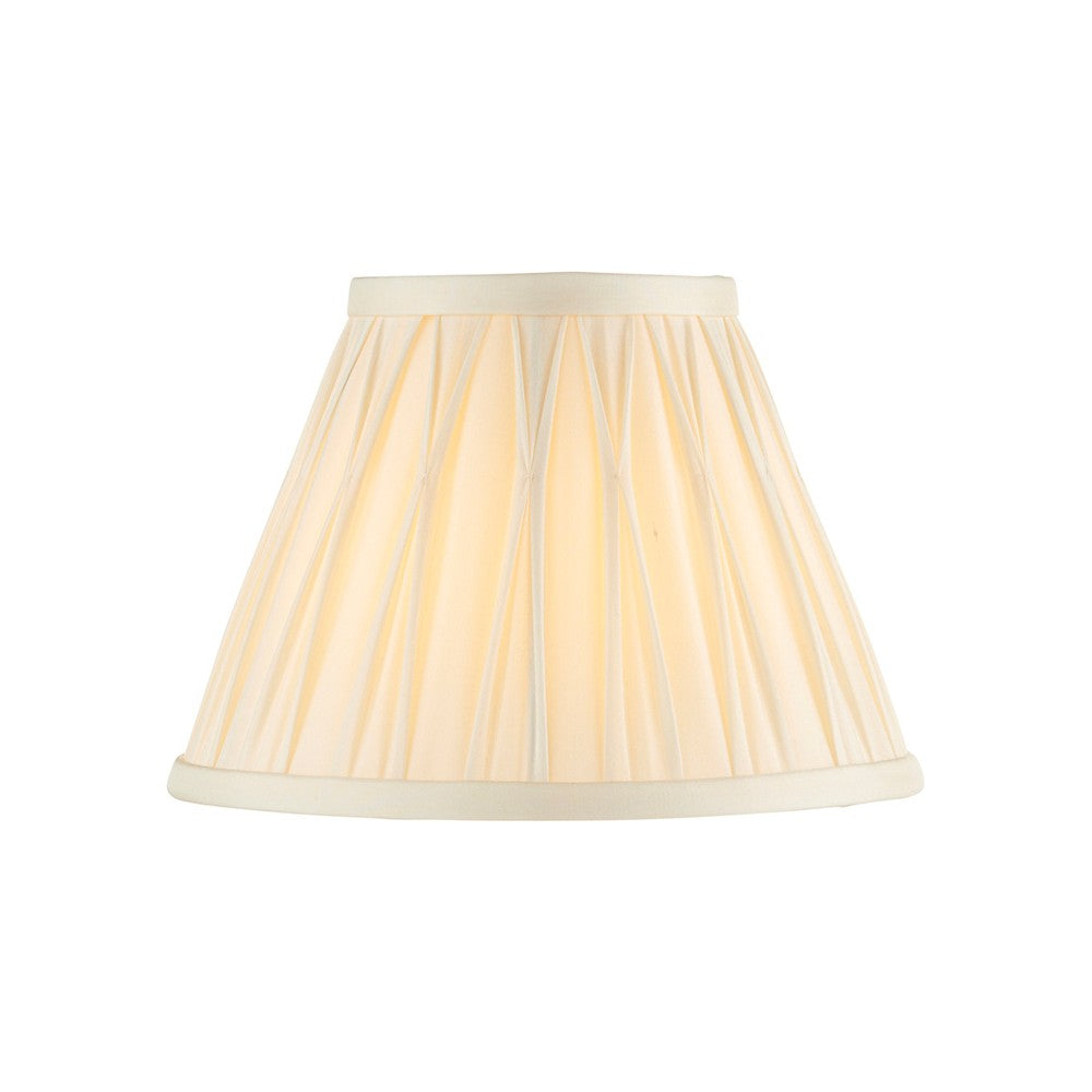 Bevdon 20cm tapered lamp shade in ivory silk with pinch-pleat detailing and cream trim, shown against a plain white background.