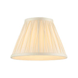Bevdon 20cm tapered lamp shade in ivory silk with hand-stitched pinch pleats and cream trim, shown on a plain white background.
