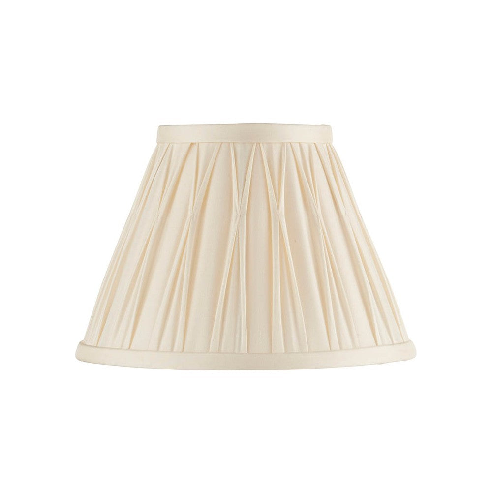Bevdon 20cm tapered lamp shade in ivory silk with hand-stitched pinch pleats and taped edges, shown on a plain white background.